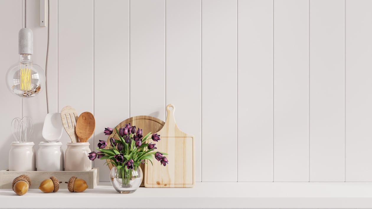 kitchen interior with kitchen standing on white shelf.